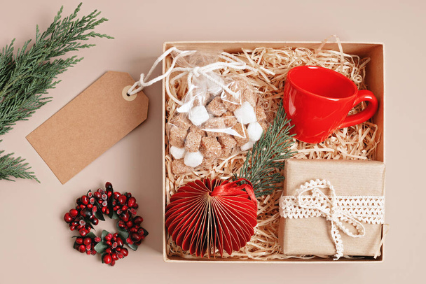 refined christmas care box with coffee cup, gift and xmas ornament
